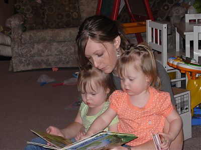 The twins reading a book from the Never Ending Story.