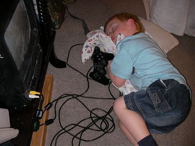 Quinan asleep by the PS2